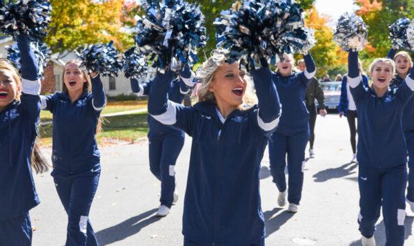Upper Iowa University cheerleaders march in a parade